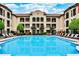 Resort-style pool area with lounge chairs and views of the surrounding apartments at 955 Juniper Ne St # 2322, Atlanta, GA 30309
