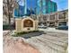 Entrance sign for Tuscany Condominiums on a brick road in an urban setting at 955 Juniper Ne St # 2322, Atlanta, GA 30309