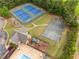 Community amenities featuring tennis courts, basketball court, playground and pool near lush trees and landscaping at 4235 Night Sky Ln, Cumming, GA 30041