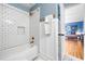 Stylish bathroom with white subway tile, modern fixtures, and a shower-tub combo at 4235 Night Sky Ln, Cumming, GA 30041