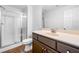 Bathroom showcasing a stand-up shower, toilet, and large vanity with sink at 4235 Night Sky Ln, Cumming, GA 30041