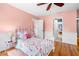 Charming bedroom featuring hardwood floors and a ceiling fan at 4235 Night Sky Ln, Cumming, GA 30041