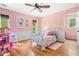 Bright and cozy bedroom with hardwood floors and a ceiling fan at 4235 Night Sky Ln, Cumming, GA 30041