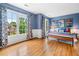 Bright bedroom featuring hardwood floors, large windows, and whimsical decor at 4235 Night Sky Ln, Cumming, GA 30041