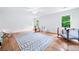 Spacious bonus room with hardwood floors, neutral walls, and a ceiling fan at 4235 Night Sky Ln, Cumming, GA 30041