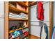 Organized closet with shelves, hanging rods, and space for shoes, clothes, and accessories at 4235 Night Sky Ln, Cumming, GA 30041