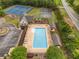 Aerial view showcases a large community pool with amenities like tennis and basketball courts at 4235 Night Sky Ln, Cumming, GA 30041