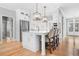 Bright, open kitchen with a large island, stainless steel appliances, and modern lighting at 4235 Night Sky Ln, Cumming, GA 30041