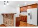 Stylish kitchenette with wooden cabinets, stone accents, and modern appliances at 4235 Night Sky Ln, Cumming, GA 30041
