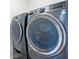 Modern laundry room with front-load washer and dryer at 4235 Night Sky Ln, Cumming, GA 30041