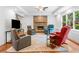 Cozy living room with stone fireplace, recessed lighting, and ceiling fan at 4235 Night Sky Ln, Cumming, GA 30041