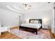 Spacious main bedroom featuring a trey ceiling, hardwood floors, and a walk-in closet at 4235 Night Sky Ln, Cumming, GA 30041