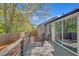 Wooden back deck with a metal railing overlooking a fenced backyard with mature trees at 4336 Southvale Dr, Decatur, GA 30034
