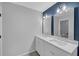 Modern bathroom features double vanity with white countertops, modern fixtures, and plenty of lighting at 4336 Southvale Dr, Decatur, GA 30034
