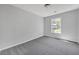 Cozy bedroom with new gray carpet and a window providing natural light at 4336 Southvale Dr, Decatur, GA 30034