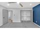 Well-lit bedroom boasts a ceiling fan, closet with open shelving, and hardwood floors for a serene retreat at 4336 Southvale Dr, Decatur, GA 30034