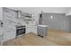Modern kitchen with stainless steel appliances, custom cabinetry, and elegant backsplash at 4336 Southvale Dr, Decatur, GA 30034