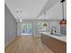 Modern kitchen with quartz countertops, stylish pendant lights, and an adjacent dining area with sliding glass doors at 4336 Southvale Dr, Decatur, GA 30034