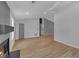 Spacious living room with a fireplace, hardwood floors, and light gray walls, creating a cozy atmosphere at 4336 Southvale Dr, Decatur, GA 30034