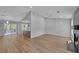 Open living space featuring a modern kitchen, living room area with luxury vinyl plank flooring and cozy fireplace at 4336 Southvale Dr, Decatur, GA 30034