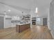 Open-concept living space combines kitchen and living room with modern design and luxury vinyl plank flooring at 4336 Southvale Dr, Decatur, GA 30034