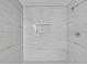 Elegant walk-in shower with marble-patterned tile, rainfall showerhead, and a convenient recessed niche at 4336 Southvale Dr, Decatur, GA 30034