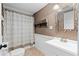 Charming bathroom with decorative mirror, patterned shower curtain, and white vanity at 6265 Reives Rd, Cumming, GA 30041