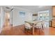 This dining room features hardwood floors, modern decor, and ample natural light at 6265 Reives Rd, Cumming, GA 30041