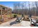 Backyard firepit area with seating, perfect for outdoor entertaining and enjoying nature at 6265 Reives Rd, Cumming, GA 30041