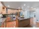 Open kitchen featuring granite counters, an island, and stainless steel appliances with a view to the office area at 6265 Reives Rd, Cumming, GA 30041