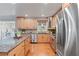 Kitchen area features granite countertops, a kitchen island, and stainless steel appliances at 6265 Reives Rd, Cumming, GA 30041