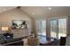 Bright living room with hardwood floors, vaulted ceilings, and access to the deck at 6265 Reives Rd, Cumming, GA 30041