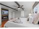 Relaxing main bedroom with a fireplace, ceiling fan and ensuite bath at 6265 Reives Rd, Cumming, GA 30041