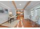 Bright and airy home office with hardwood floors, a desk, and a view of the adjacent kitchen, perfect for productivity at 6265 Reives Rd, Cumming, GA 30041
