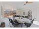 Covered outdoor patio with ceiling fans, a dining table set for six, and comfortable seating at 6265 Reives Rd, Cumming, GA 30041
