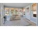Bright sunroom with ample natural light, cozy seating, and access to the outdoors at 6265 Reives Rd, Cumming, GA 30041