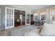 Sunroom with french doors leading to the dining room and plenty of sunlight at 6265 Reives Rd, Cumming, GA 30041