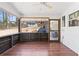 Cozy sunroom with wood floors, a ceiling fan, and views of the backyard at 6265 Reives Rd, Cumming, GA 30041