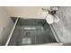 Bathroom featuring tiled shower, glass door, and toilet with neutral gray walls at 2849 Appling Way, Kennesaw, GA 30152