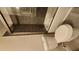 Bathroom featuring a tiled shower and tub combination, toilet, and neutral wall color at 2849 Appling Way, Kennesaw, GA 30152