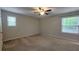 Standard bedroom featuring neutral walls, carpet flooring, and natural light from windows at 2849 Appling Way, Kennesaw, GA 30152