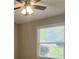 Cozy bedroom with ceiling fan and natural light at 2849 Appling Way, Kennesaw, GA 30152