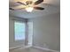 Bedroom features carpet flooring, neutral walls, and natural light from the window at 2849 Appling Way, Kennesaw, GA 30152