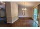 Open dining area with sliding glass doors, wood floors, and chandelier, perfect for entertaining at 2849 Appling Way, Kennesaw, GA 30152