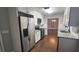 Bright kitchen with stainless steel appliances, white cabinets, and granite countertops at 2849 Appling Way, Kennesaw, GA 30152