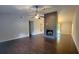 Spacious living room with a striking tile fireplace, wood floors, and vaulted ceilings at 2849 Appling Way, Kennesaw, GA 30152