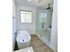 Contemporary bathroom featuring a soaking tub and walk in shower with black hardware at 261 Arborview Dr, Mcdonough, GA 30252