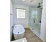 Bathroom with freestanding soaking tub and a separate glass-enclosed tiled shower at 261 Arborview Dr, Mcdonough, GA 30252