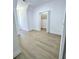 Bedroom with light wood floors and white walls with access to a large walk in closet at 261 Arborview Dr, Mcdonough, GA 30252