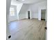 Bright, airy bedroom with neutral walls, hardwood floors, and a large window offering abundant natural light at 261 Arborview Dr, Mcdonough, GA 30252